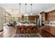 Beautiful kitchen with stainless appliances, center island, and barstool seating, and attached dining room at 30041 Marys Dr, Conifer, CO 80433
