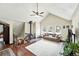 Inviting living room with vaulted ceilings, a wood burning stove, and bright natural light at 30041 Marys Dr, Conifer, CO 80433