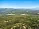 Picturesque mountain range view from this forested property at 30041 Marys Dr, Conifer, CO 80433
