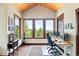Office with hardwood floors, lots of windows, and mountain views at 30041 Marys Dr, Conifer, CO 80433