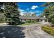 Beautiful home with well-manicured lawn, mature trees, and a long driveway, creating a welcoming curb appeal at 4285 S Hudson Pkwy, Englewood, CO 80113