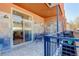 Inviting covered balcony with slate tile and grill, perfect for outdoor dining and relaxing at 3040 Zuni St # F, Denver, CO 80211