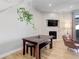 Bright dining area features a modern table and chair set with a fireplace in the background at 3040 Zuni St # F, Denver, CO 80211