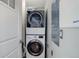 Efficient laundry area with stacked washer and dryer units, maximizing space and convenience at 3040 Zuni St # F, Denver, CO 80211