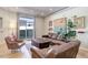 Bright living room features a sliding glass doors, comfortable seating, and lots of natural light at 3040 Zuni St # F, Denver, CO 80211