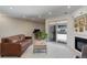 Spacious and bright living area with sliding glass doors to balcony, fireplace, and room for an office at 3040 Zuni St # F, Denver, CO 80211