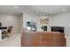 Bright living room with fireplace, walk-out balcony, and space for a work-from-home area at 3040 Zuni St # F, Denver, CO 80211