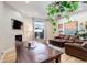 Cozy living room features a fireplace, sliding glass doors, comfortable seating, and lots of natural light at 3040 Zuni St # F, Denver, CO 80211