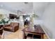 Open-concept living space boasts modern kitchen, stainless steel appliances, and comfortable leather seating at 3040 Zuni St # F, Denver, CO 80211