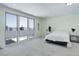 Bright main bedroom featuring large windows and neutral carpet flooring at 3040 Zuni St # F, Denver, CO 80211