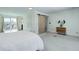The bedroom offers access to the balcony, a sliding barn door to the closet, and natural light at 3040 Zuni St # F, Denver, CO 80211