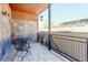 Cozy patio with stone accent wall, metal railing, and outdoor seating at 3040 Zuni St # F, Denver, CO 80211