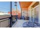 Cozy patio with stone accent wall, metal railing, and outdoor seating at 3040 Zuni St # F, Denver, CO 80211