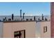 Rooftop view showcasing modern building architecture with mountain view at 3040 Zuni St # F, Denver, CO 80211