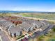 Panoramic aerial view of the property showcasing its proximity to roads, parking, and mountain views at 4500 Copeland Cir # 104, Highlands Ranch, CO 80126