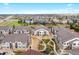 Aerial view shows manicured landscaping, community walkways, and proximity to nearby highways at 4500 Copeland Cir # 104, Highlands Ranch, CO 80126