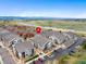 Aerial view highlighting the property's location near major highways, shops and the Rocky Mountains at 4500 Copeland Cir # 104, Highlands Ranch, CO 80126
