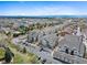High-angle aerial view of residential neighborhood showcasing the well-planned layout with mature trees and parking at 4500 Copeland Cir # 104, Highlands Ranch, CO 80126