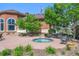 Cozy backyard featuring a relaxing hot tub and comfortable seating area at 4500 Copeland Cir # 104, Highlands Ranch, CO 80126