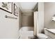 Bathroom with tiled shower and tub, granite countertops, and framed artwork on the wall at 4500 Copeland Cir # 104, Highlands Ranch, CO 80126