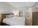 Well-lit bedroom with a view of a walk-in closet and a bathroom, creating a seamless and accessible space at 4500 Copeland Cir # 104, Highlands Ranch, CO 80126