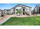 Inviting townhouse with a well-maintained lawn and exterior stairs leading to the entrance at 4500 Copeland Cir # 104, Highlands Ranch, CO 80126