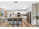 Modern kitchen with a granite island, stainless steel appliances, and a dining area adjacent at 4500 Copeland Cir # 104, Highlands Ranch, CO 80126