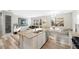 Open concept kitchen with granite countertops, a large island, and seamless flow to the living spaces at 4500 Copeland Cir # 104, Highlands Ranch, CO 80126
