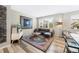 Comfortable living room with ample natural light, a cozy sofa, and stylish decor at 4500 Copeland Cir # 104, Highlands Ranch, CO 80126