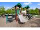 Community playground featuring a slide, stairs, and other fun equipment for children at 4500 Copeland Cir # 104, Highlands Ranch, CO 80126
