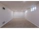Finished basement with neutral carpet, recessed lighting, and windows at 2120 S Ouray St, Aurora, CO 80013