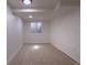 Basement bedroom featuring natural light, carpet, and large window at 2120 S Ouray St, Aurora, CO 80013