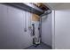 Exposed basement plumbing in a utility room with exposed pipes and concrete walls and floors at 2120 S Ouray St, Aurora, CO 80013