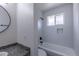 Newly remodeled bathroom with a shower-tub combo and white subway tile at 2120 S Ouray St, Aurora, CO 80013