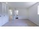 Bedroom with carpet, access to bathroom, and closet with louvered doors at 2120 S Ouray St, Aurora, CO 80013