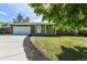 Charming single-story home featuring a well-maintained lawn, driveway, and attached garage at 2120 S Ouray St, Aurora, CO 80013