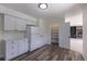 Bright kitchen with white cabinets, laminate countertops, and a pantry, providing ample storage space at 2120 S Ouray St, Aurora, CO 80013