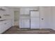 A well-lit kitchen featuring updated white cabinets and a modern laminate countertop at 2120 S Ouray St, Aurora, CO 80013