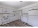 Well-equipped kitchen featuring white appliances, cabinetry, hardwood floors, and ample counter space at 2120 S Ouray St, Aurora, CO 80013