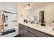 Elegant bathroom featuring a double vanity, modern fixtures, and a glass-enclosed shower at 10136 Worchester St, Commerce City, CO 80022