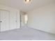 Neutral carpeted bedroom features a large closet and an en-suite bathroom at 10136 Worchester St, Commerce City, CO 80022