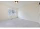 Bright bedroom with neutral carpeting and a large window creating a serene atmosphere at 10136 Worchester St, Commerce City, CO 80022