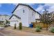 Exterior side view of a home with white siding, attached garage, and privacy fence at 10136 Worchester St, Commerce City, CO 80022