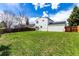 Expansive backyard with well-maintained lawn, wood fencing, and a glimpse of the home's exterior at 10720 Moore Cir, Westminster, CO 80021