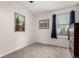 Cozy bedroom with wood dresser, plush carpet, and natural light from a window at 10720 Moore Cir, Westminster, CO 80021