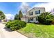 Attractive two-story home with a two-car garage and a well-maintained front yard with mature trees at 10720 Moore Cir, Westminster, CO 80021