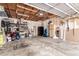 Spacious garage with concrete floor, overhead storage, and workbench space at 10720 Moore Cir, Westminster, CO 80021