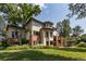 Expansive backyard view highlighting the outdoor seating and manicured landscaping at 6722 S Wolff Ct, Littleton, CO 80128