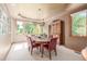 Formal dining room features a tray ceiling, large window overlooking the back yard, and a china cabinet at 6722 S Wolff Ct, Littleton, CO 80128