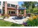 Beautiful outdoor living area with patio seating, perfect for entertaining in the landscaped backyard at 6722 S Wolff Ct, Littleton, CO 80128